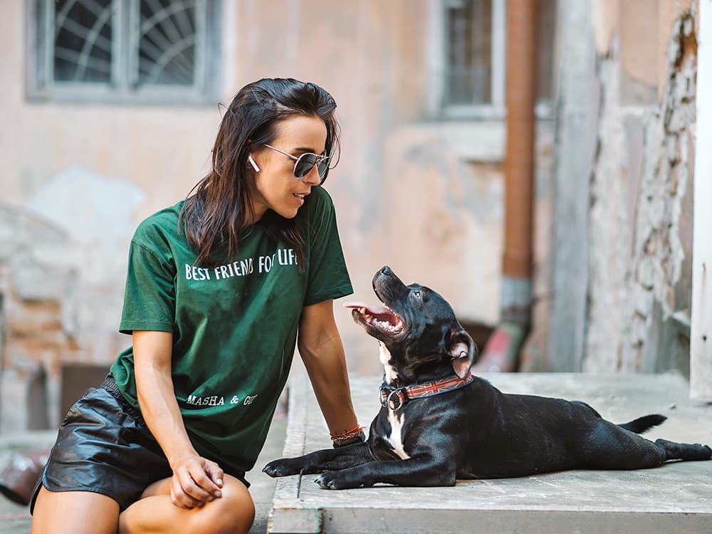 woman with staffordshire bull terrier