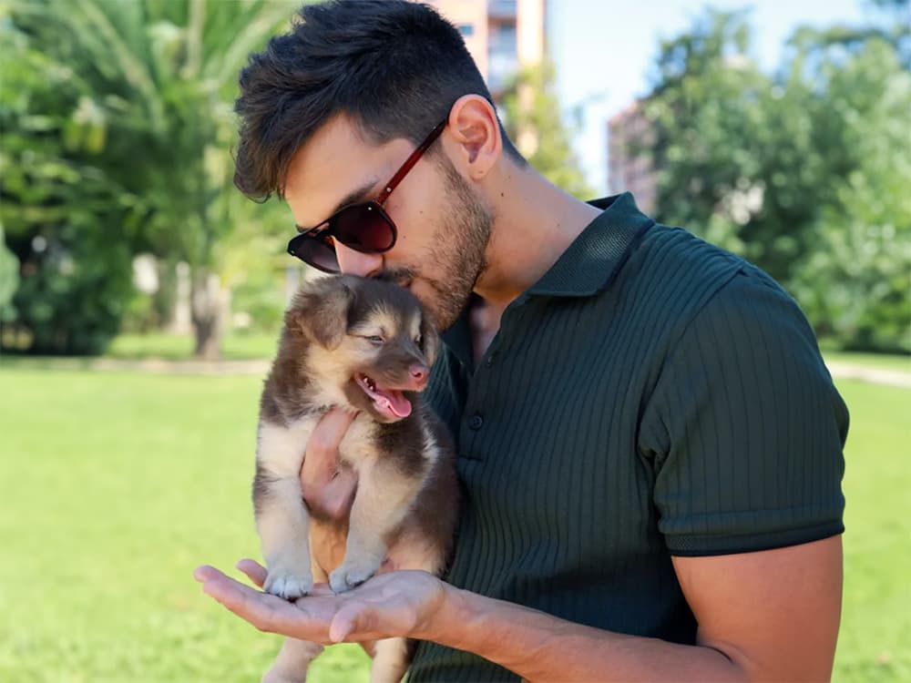 man with puppy in dating profile