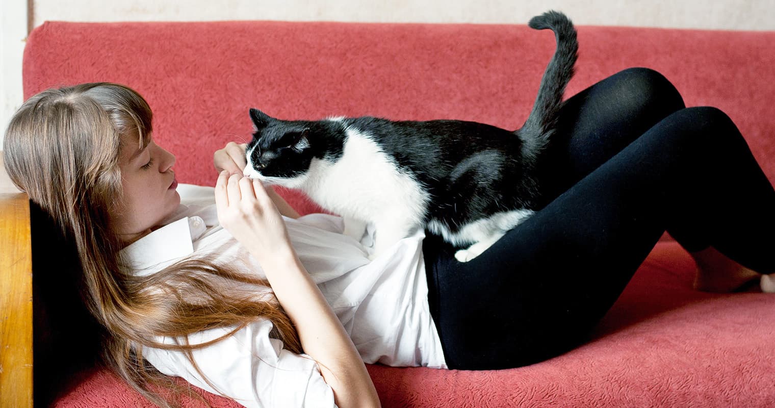 Woman with black and white cat